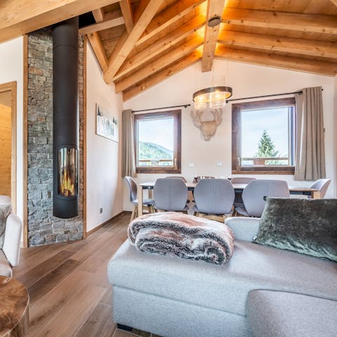 Snuggle up on the sofa in front of your cosy wood burner after a day on the slopes