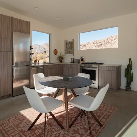 Cook and eat together in the sleek open-plan dining space