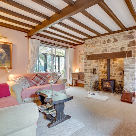 Curl up by the living room's fire with a good book on cooler nights