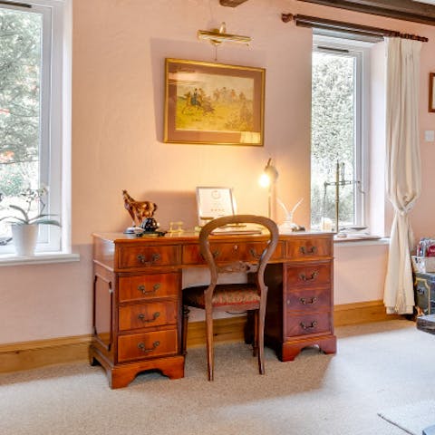 Catch up on work at the elegant desk or journal your day's activities