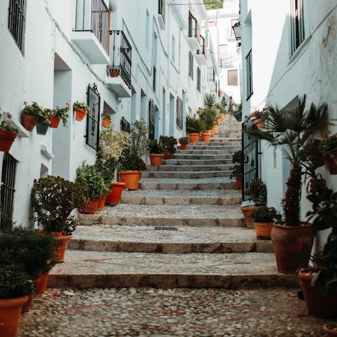 Drive through the countryside to Frigiliana, known for its Moorish architecture