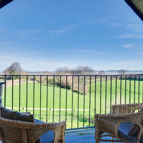Take in picturesque views over the surrounding countryside from the balcony terrace