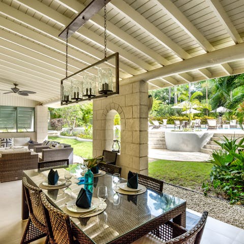 Fire up the grill for a grilled feast under the shaded pergola