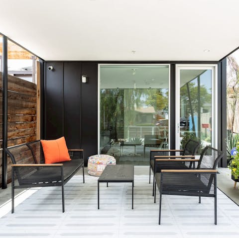 Take shelter during the hottest part of the afternoon on the home's covered terrace