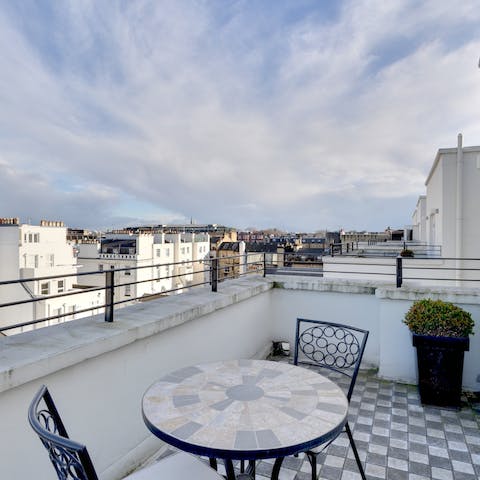Enjoy a drink on the private balcony with its views over Kensington