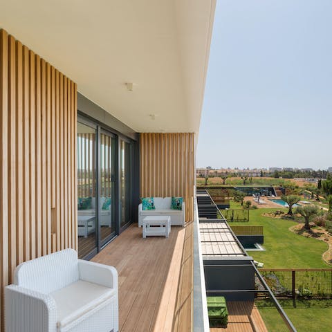 Take in the surrounding greenery from the comfort of your long balcony