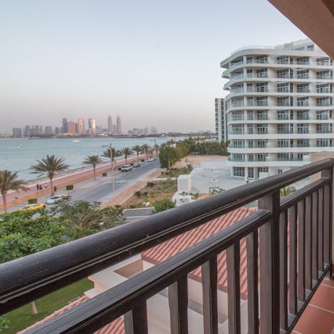 Take in the vistas over the sea and the Dubai skyline from your balcony