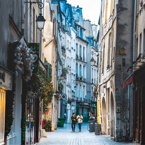 Explore the Marais' historic streets full of boutiques and cafés, an eight-minute walk away