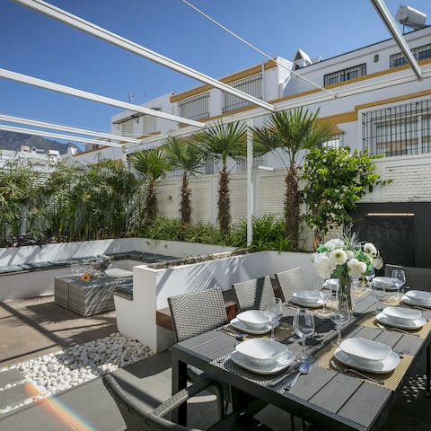 Gather for golden hour drinks and barbecue meals