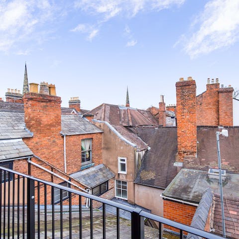 Look out over neighbouring rooftops from your private balcony