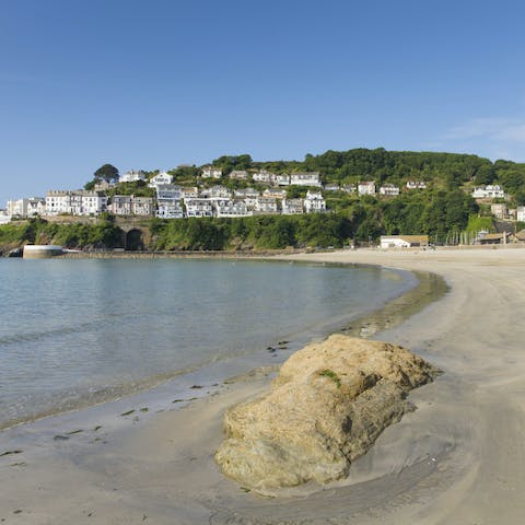 Sink your toes in the sand at East Looe Beach, a twenty-minute stroll from your door