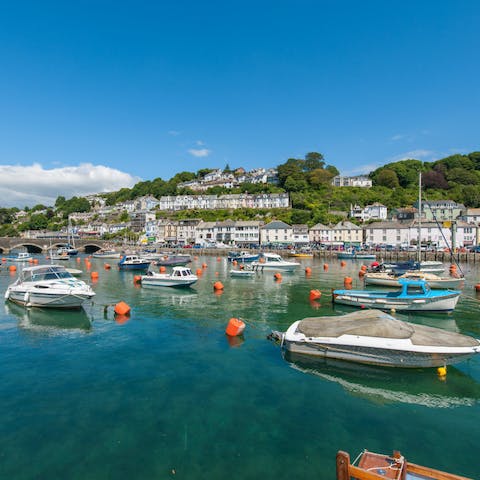 Watch the boats come in and out of Looe Harbour, an eighteen-minute walk away