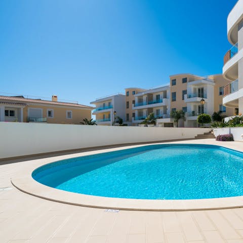 Swim in the communal pool to cool off in the Algarve heat