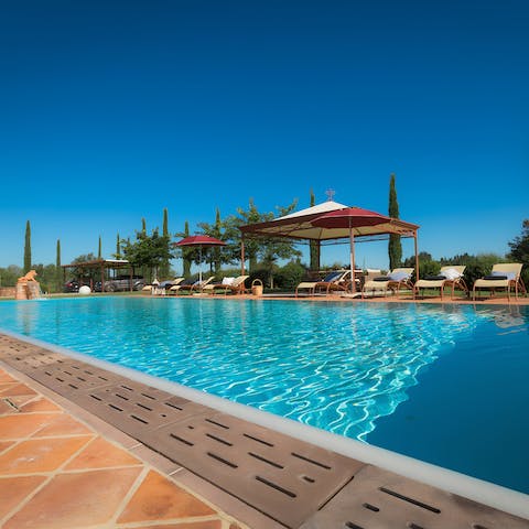 Splash around in the sunshine in the private outdoor swimming pool