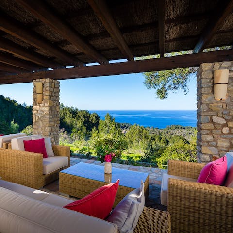 Enjoy views of the Mediterranean from the covered terrace