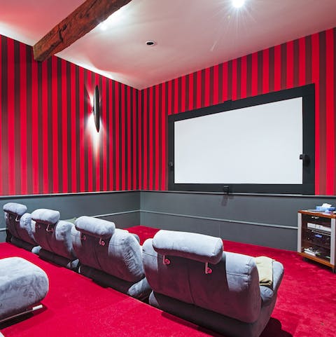 Watch one of the eight hundred movies available in the state-of-the-art home cinema