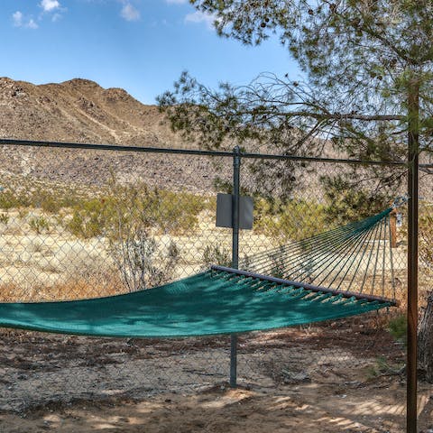Hide from the desert heat in the shaded hammock