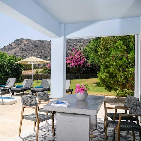 Lounge under the sun on the deck chairs, and escape the shade under the pergola