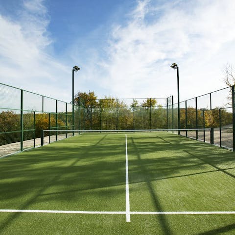 Start an active day with a few sets of tennis using the private court