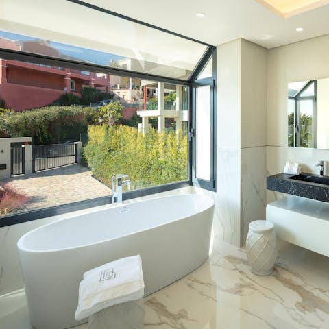 Enjoy a long soak in the freestanding bathtub