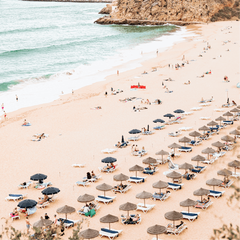 Stroll along the soft sand of Praia dos Alemães, a short drive away