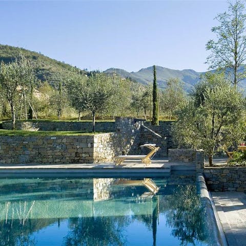 Admire the landscape as you sunbathe by the shared swimming pool