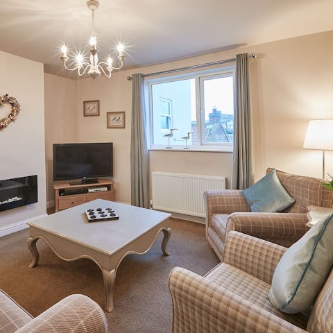 Curl up for cosy film nights in the seperate, elegant sitting room
