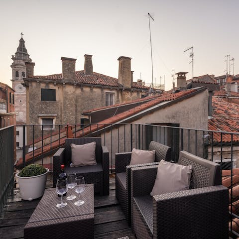 Grab wine and nibbles to take up to the Venetian wooden terrace