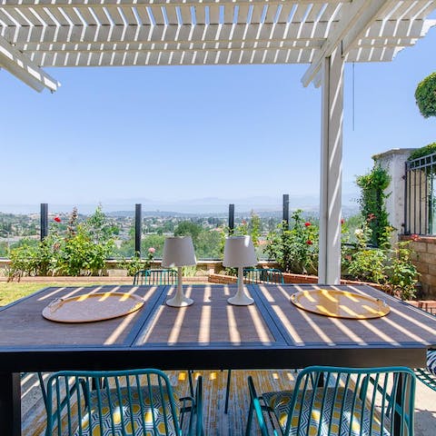 Lay the table for lunch with a view on the shady outdoor deck 