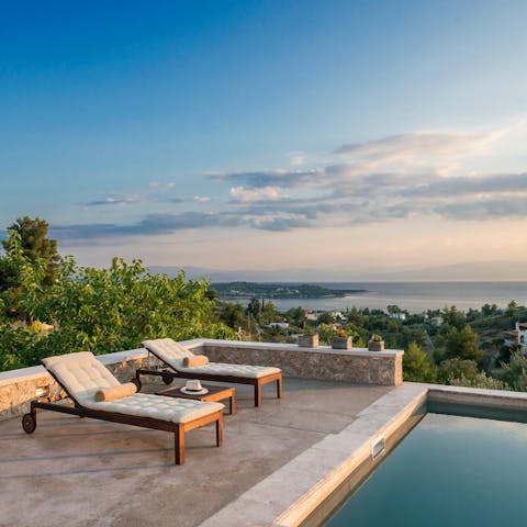 Admire beautiful views out towards the Ionian Sea from the pool deck
