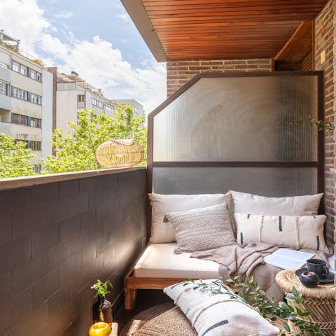 Soak up the morning sun with coffee on the balcony sofa