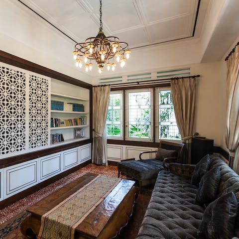 Unwind on the velvet chesterfield style sofa in the study with a good book.