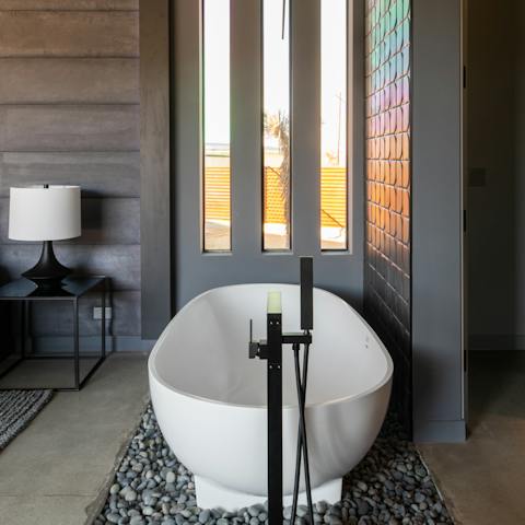 Relax in the freestanding bathtub