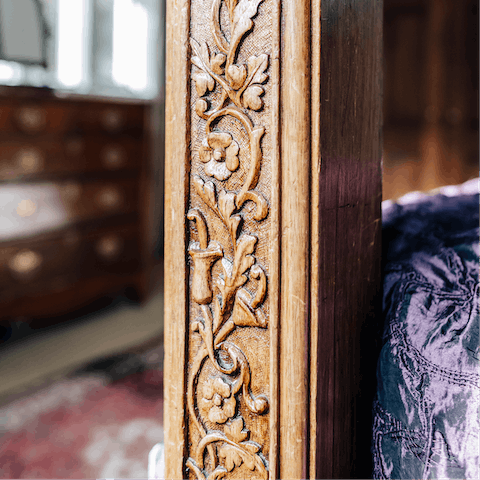 Fall asleep in the incredible four-poster bed, made from hand-carved wood