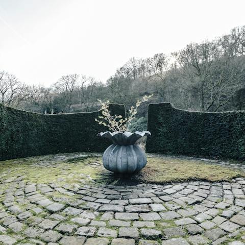 Explore the beautiful gardens and spot the outdoor sculptures
