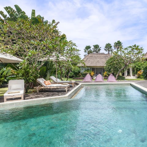 Swim in your private pool amid the tropical gardens