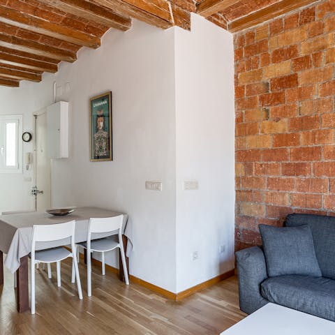 Admire the original timber beams and exposed brickwork of this renovated building