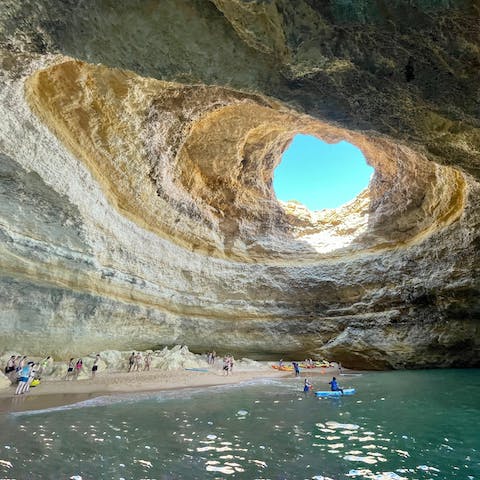 Make the 45-minute drive to the stunning Benagil Cave in Carvoeiro