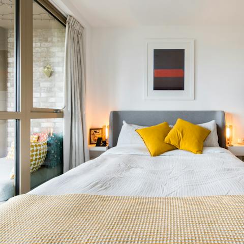 Wake up to views of Hackney Wick from the bedroom's floor-to-ceiling windows