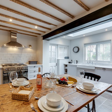 Share cheese and wine at the dining table in the kitchen