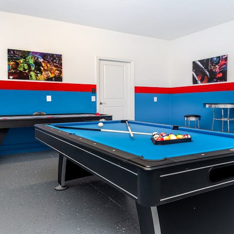 Enjoy a game of pool or air hockey in your games room