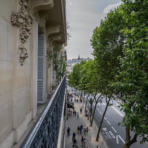 Take in the views over the iconic Rue du Temple