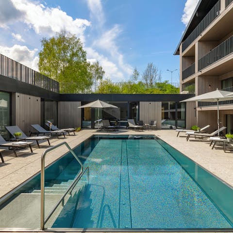 Take a dip in the heated pool before sitting back on a sun lounger
