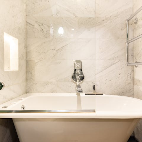 Treat yourself to an indulgent soak in the elegant freestanding bathtub