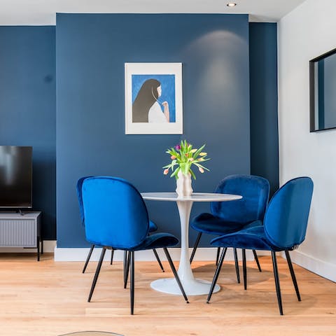 Relish a glass of wine before dinner in the dining area with its sapphire blue colour scheme