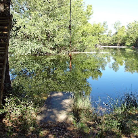 Stroll 150 metres through woodland for a dip in the lake