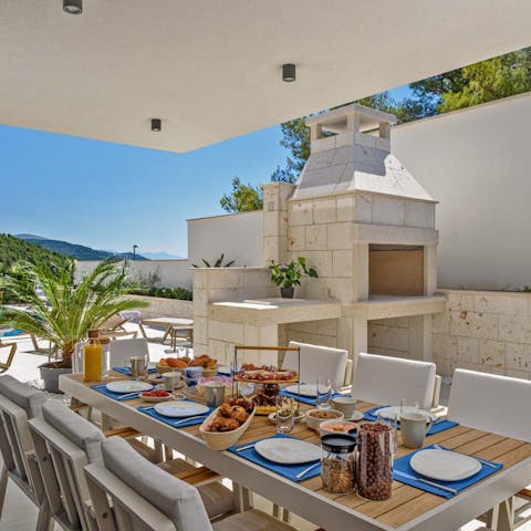 Fire up the stone barbecue for an alfresco feast in the shade