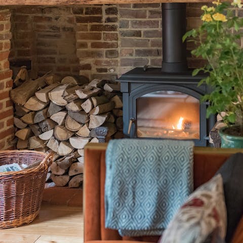 Cosy up by the fireplace after a day of exploring the nearby sights