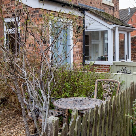 Enjoy a bite to eat alfresco in the patio garden