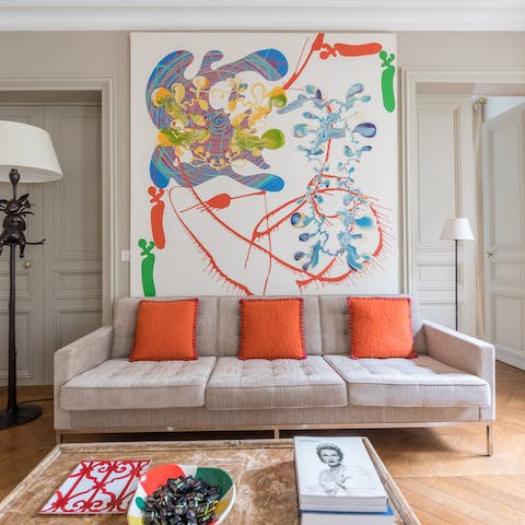 Idly sip your coffee in the vibrant living space before heading out into the streets of Paris